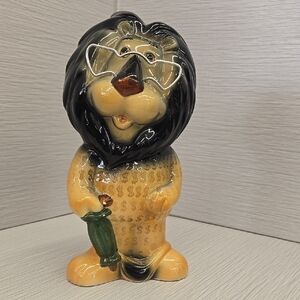 Whimsical Black and Tan Ceramic Lion Art